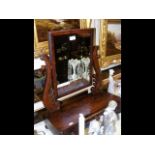 An antique toilet mirror with drawers to the front