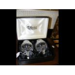 A pair of Waterford crystal brandy glasses in pres