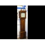 An antique thirty hour grandfather clock, having o