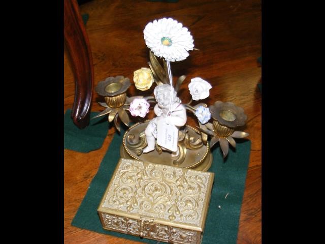 An embossed brass trinket box and a brass and porc