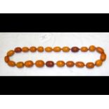 An antique amber bead work necklace - 138 grams