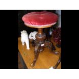 An antique piano stool