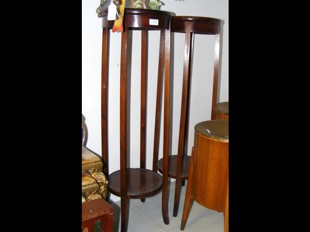 A pair of mahogany jardiniere stands