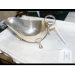 A silver sauce boat with Sheffield hallmark