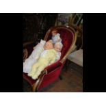 A Victorian mahogany nursing chair with red velour