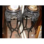 A pair of antique oriental carved hardwood and mar