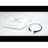 A designer diamond solitaire ring in 18ct white go