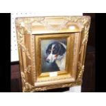 A gilt framed coloured print of dog