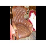 A Victorian mahogany framed library armchair with