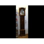 A 19th century eight day grandfather clock with ar