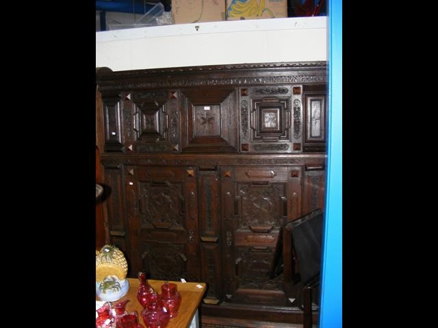 A large antique carved continental oak cupboard wi - Image 2 of 2