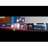 Five boxed Bachmann wagons and parcel coaches