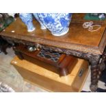 A 19th century carved oak table with single drawer
