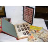 Stamps and cigarette cards with accessories