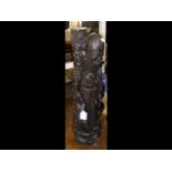 A 62cm carved hardwood oriental deity figure