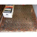 An antique rug - 200cm x 135cm (having wear to bor