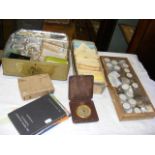 Various boxes and trays containing watch parts
