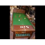 An antique Riley bar billiards table - with token