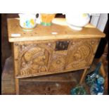 A small antique coffer - with man and lady carving