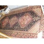 A Middle Eastern style antique rug with geometric