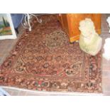 An antique Middle Eastern rug with geometric borde