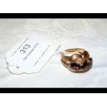 A three stone 9ct gold ring