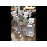 Cut glass decanters with labels, jug, etc.