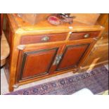 An oriental sideboard with two drawers to the apro