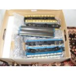 A box of model railway coaches - all unboxed