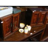 A pair of small inlaid oriental two door cabinets