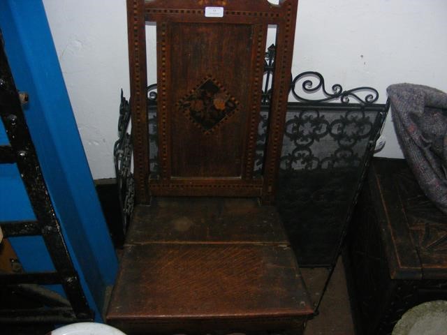 The matching pair of inlaid side chairs