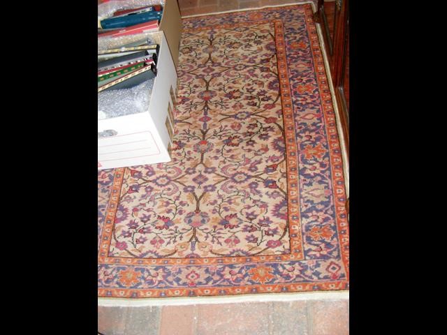 A small antique Middle Eastern style rug with geom