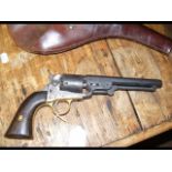 An American revolver with leather holster