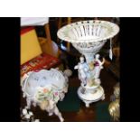 A decorative 46cm high ceramic table centre, toget