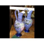 A pair of Royal Doulton stoneware jugs with tube l