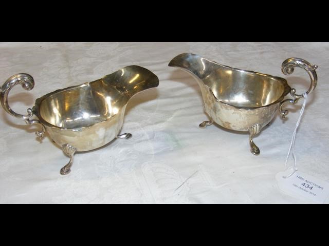 Two silver sauce boats