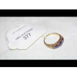 An amethyst and diamond ring in 18ct gold setting