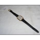 A rectangular 9ct gold Rolex gent's wrist watch wi