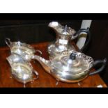 A decorative four piece silver plated teaset