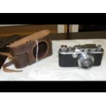 A Leica D.R.P Camera No.338128 in leather case