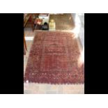 A Middle Eastern rug with red ground - 180cm x 120