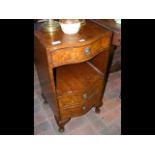 A small bow fronted walnut bedside chest