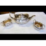 A decorative three-piece silver teaset with gadroo