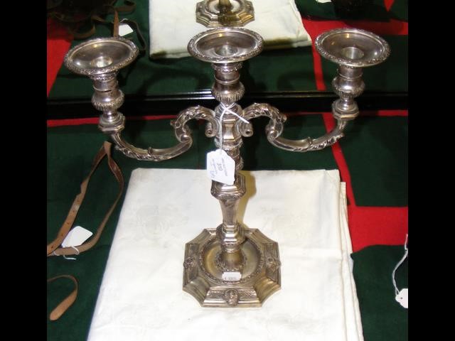 A silver three branch candelabra by Garrard & Co.,