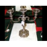 A silver three branch candelabra by Garrard & Co.,