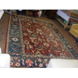 A Middle Eastern style carpet with floral geometri