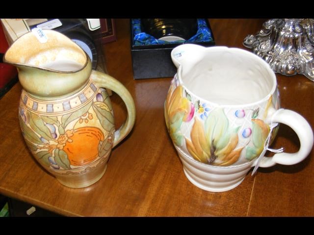 A Clarice Cliff jug with floral design, together w