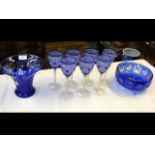 A set of seven blue overlay glass wine goblets, va