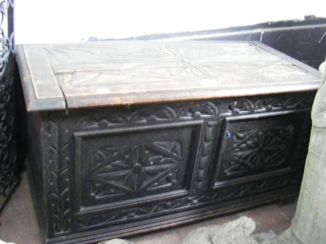 A small carved oak blanket chest