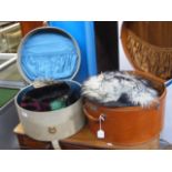 A lady's vintage hat box containing various hats,